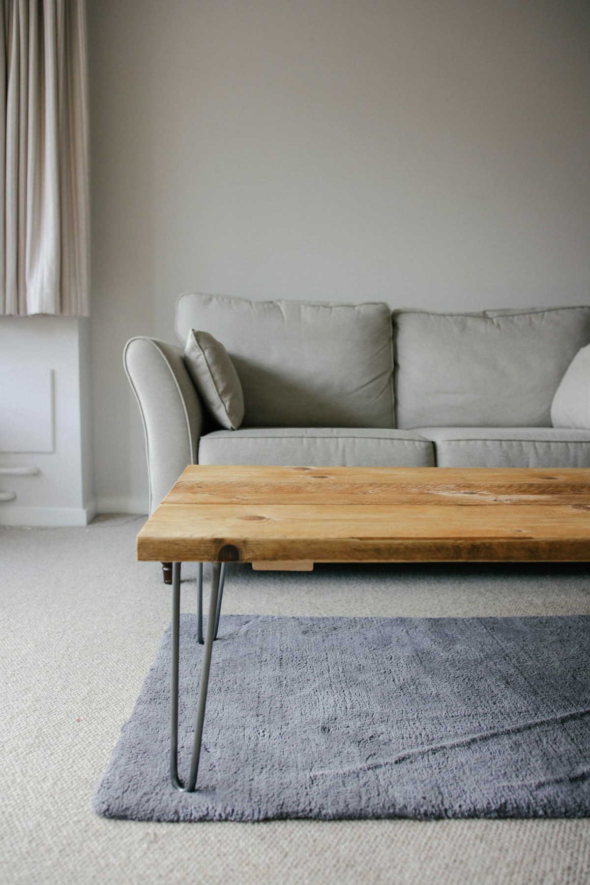 Neutral living room with a natural wood coffee table